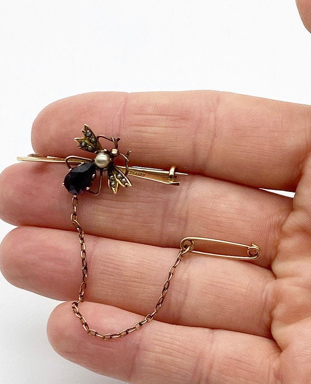 Antique 9ct gold garnet and seed pearls fly bar brooch with chain